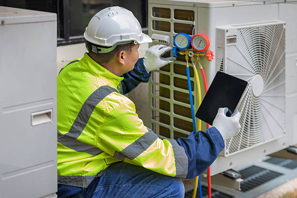 Professional Air Conditioning Repair technician working in Camanche, IA